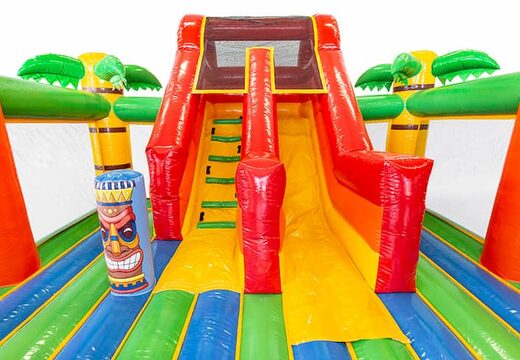 Achetez un château gonflable XXL sur le thème d'Hawaï slidebox avec un toboggan pour les enfants. Achetez des super châteaux gonflables en ligne chez JB Gonflables France