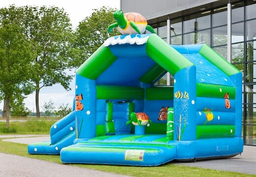 Commandez un château gonflable multifonctionnel avec une figure 3D frappante d'une tortue sur le toit pour les enfants. Commandez des châteaux gonflables en ligne chez JB Gonflables France