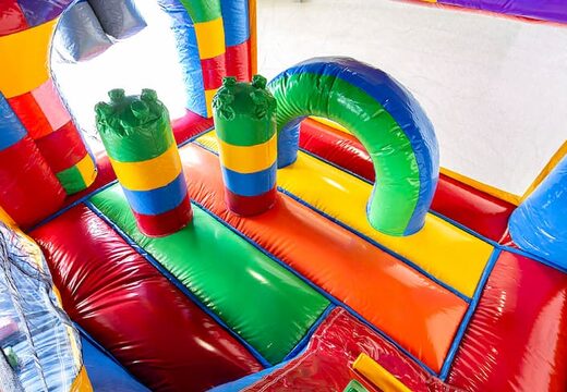 Achetez un châteaux gonflables multiplay d'intérieur avec toboggan sur le thème Lego pour les enfants. Commandez des toboggan châteaux gonflables en ligne chez JB Gonflables France
